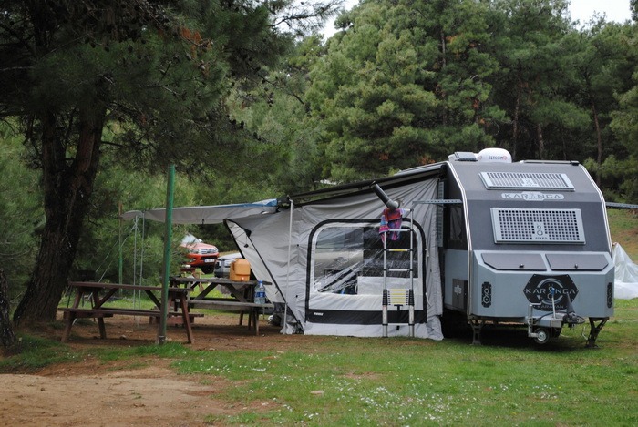 A picture of camping with a caravan